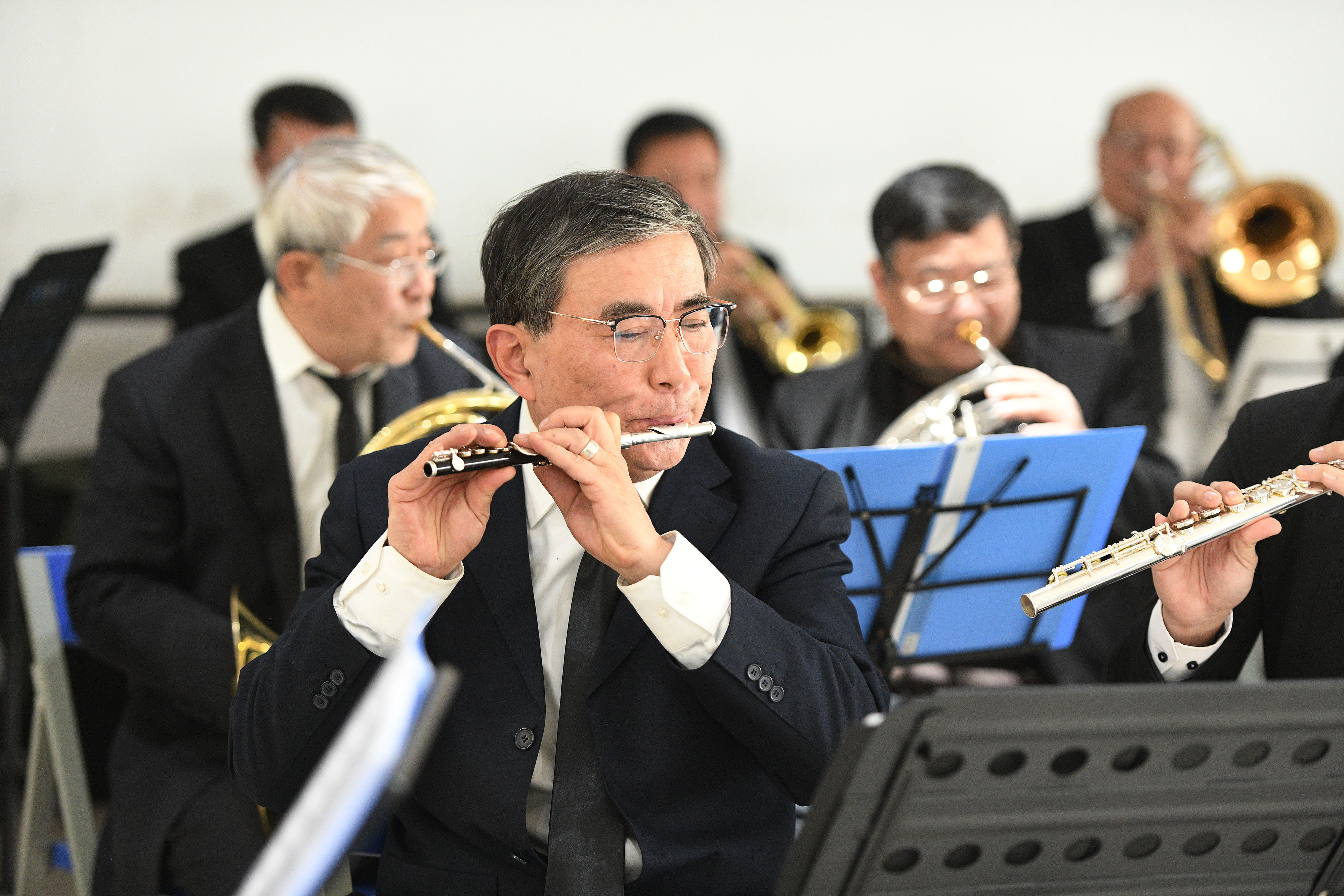 The wind orchestra of Yaohai District University for the Elderly rehearses in Hefei, east China's Anhui Province, January 7, 2024. /CFP