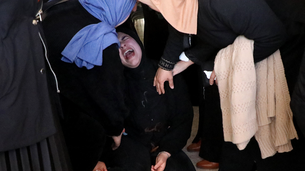 Relatives of Ahed Mahmoud Mohammed, a Palestinian woman in her early 20s, mourn at her family's home in Dura south of Hebron, at the start of her funeral on January 16, 2024, a day after she was killed when Israeli forces stromed the West Bank village. /CFP