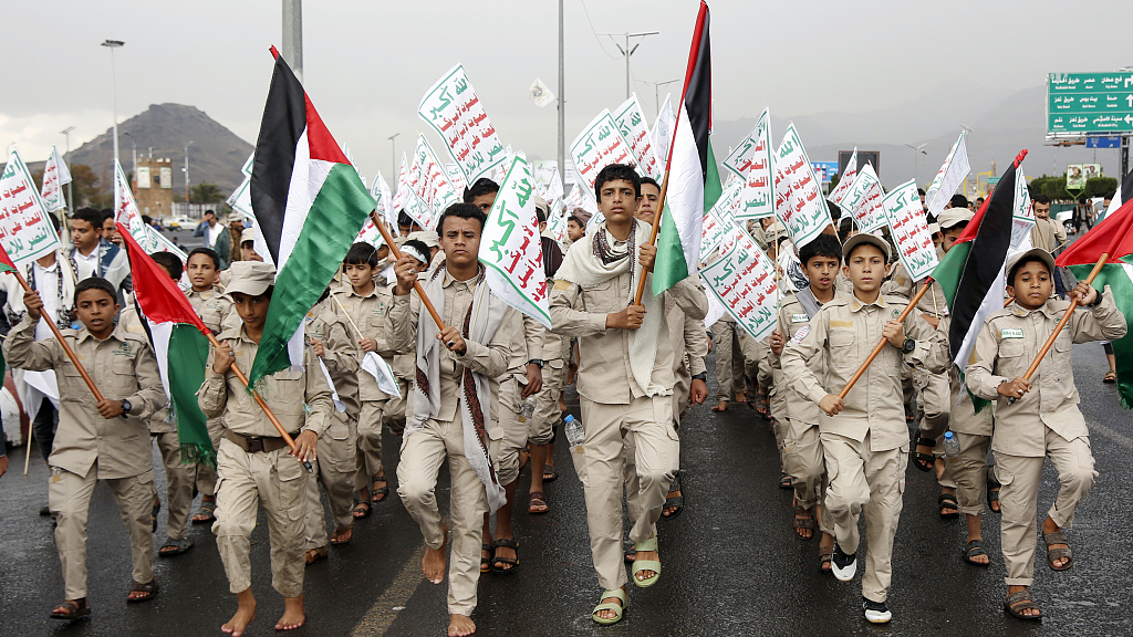 Yemen's Houthi-affiliated boys hold flags of Palestine and the Houthi emblem march during a protest held to condemn the U.S. for redesignating Houthis as a global terrorist group, and against the U.S.-British aerial attacks conducted on Yemen on January 19, 2024, in Sana'a, Yemen. /CFP