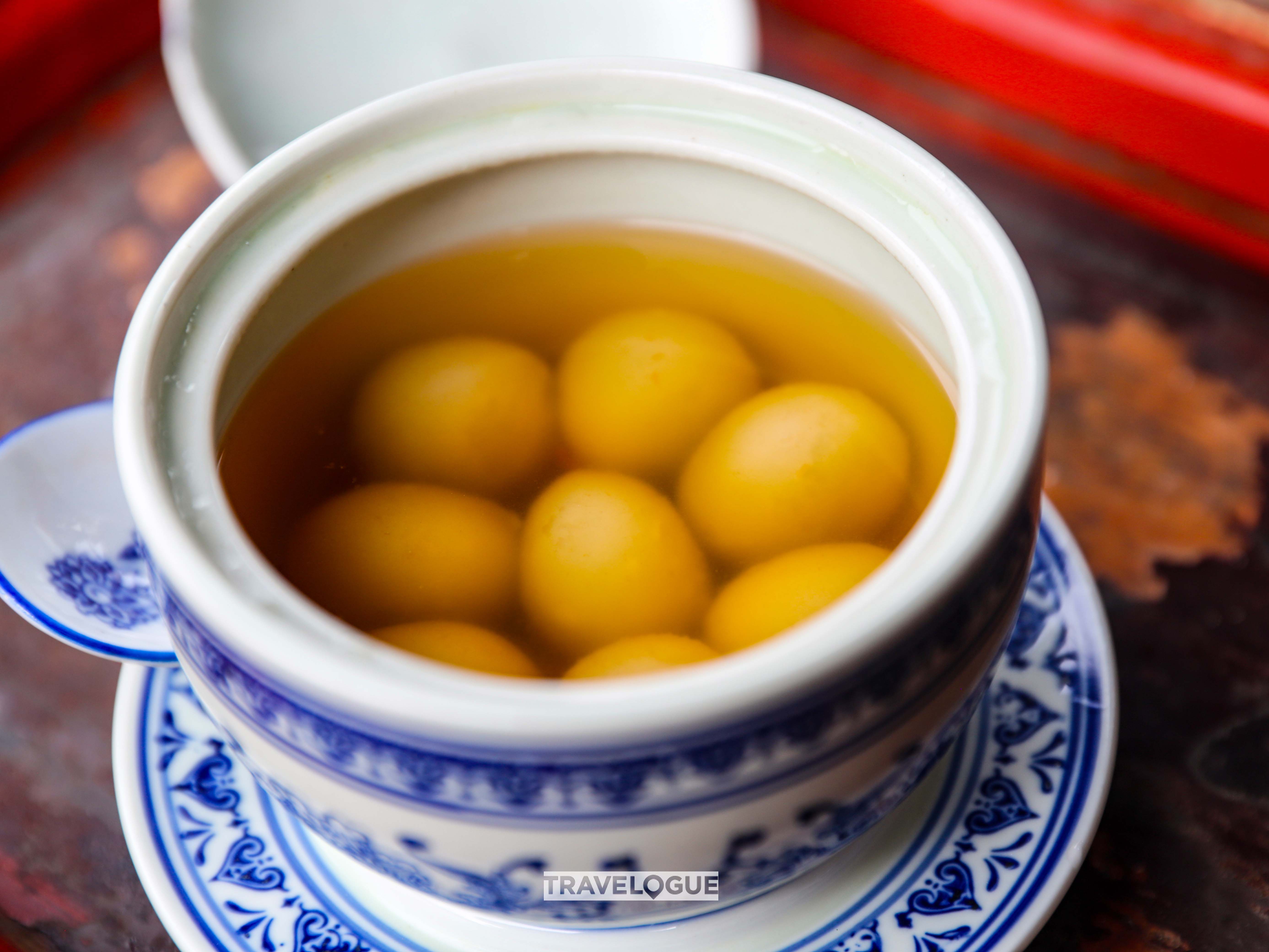Sesame-filled tangyuan in black tea soup in Xiamei Village, Fujian Province /CGTN