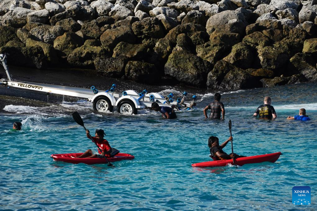 People enjoy leisure time in a bay in the Republic of Nauru, January 18, 2024. /Xinhua