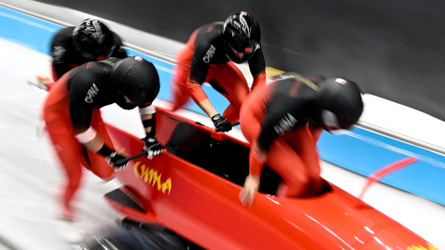 Sun Kaizhi/Wu Qingze/Wu Zhitao/Zhen Heng of China compete during the bobsleigh four-man heat at the Beijing 2022 Winter Olympics at the National Sliding Centre in Yanqing District, Beijing, China, February 20, 2022. /Xinhua