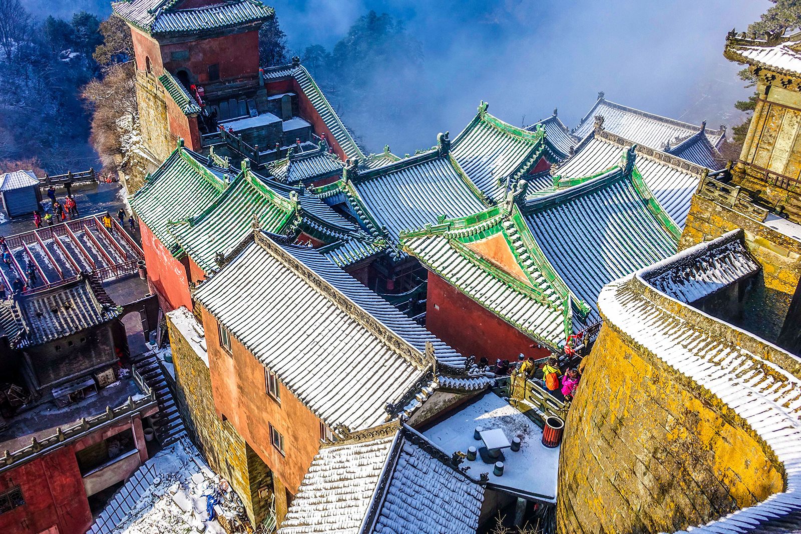 Ancient buildings are seen covered in snow in the Wudang Mountains, Hubei Province, China on March 26, 2016. /IC