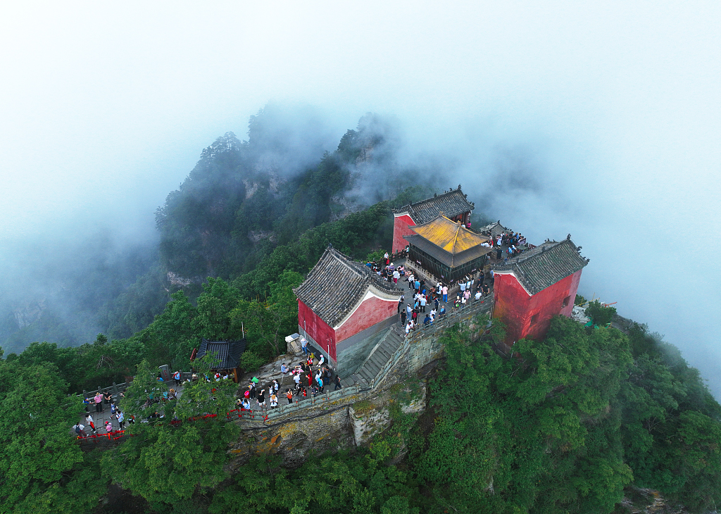 Ancient buildings are seen shrouded in mist in the Wudang Mountains, Hubei Province, China on July 4, 2022. /CFP
