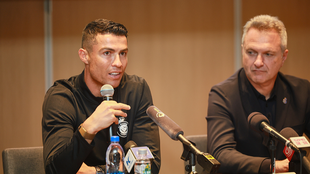 Portuguese football star Cristiano Ronaldo (L) of Saudi Arabian club Al Nassr speaks at a press conference in Shenzhen, China, January 23, 2024. /CFP