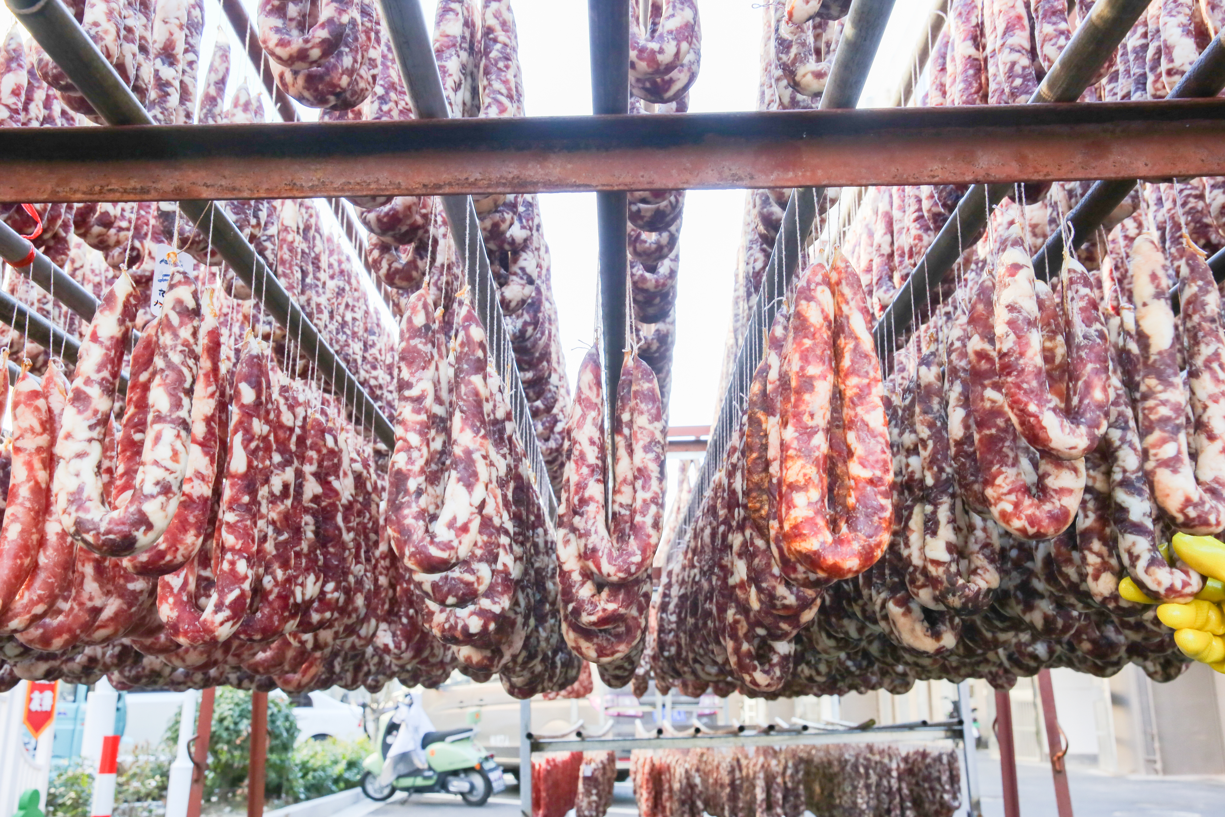 Sausages are hung out to dry at a yard Rugao, Jiangsu Province, January 23, 2024. /IC