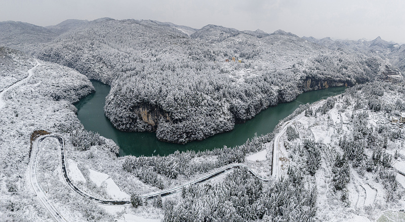 Snow-covered mountains and rivers form a winter wonderland in Guizhou Province, January 22, 2024. /CFP