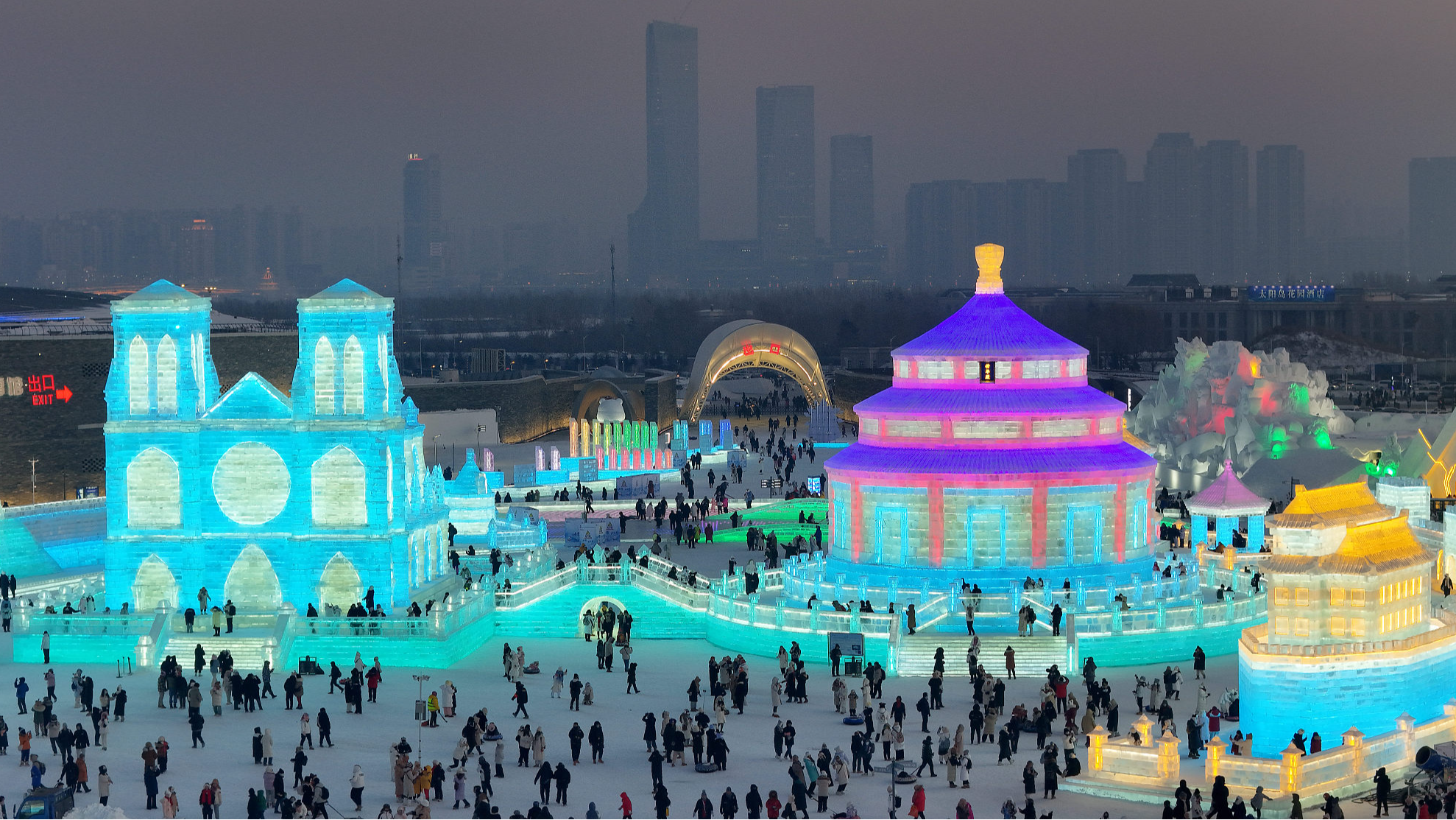 At Harbin Festival of Sculpture on Ice and Snow in Heilongjiang, China, striking replicas of two UNESCO World Heritage sites, Notre-Dame de Paris and the Temple of Heaven, stand side by side, December 23, 2023. /CFP