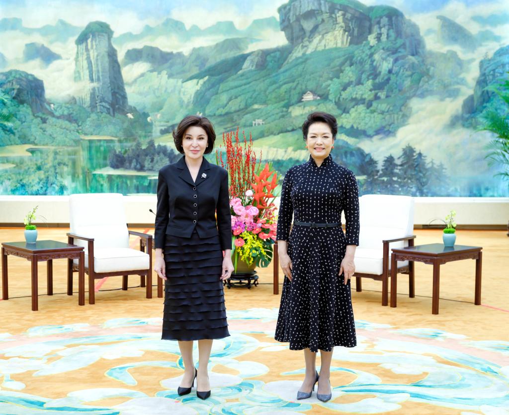 Peng Liyuan, wife of Chinese President Xi Jinping, meets with Ziroatkhon Mirziyoyeva, wife of Uzbek President Shavkat Mirziyoyev, in Beijing, capital of China, January 24, 2024. /Xinhua 