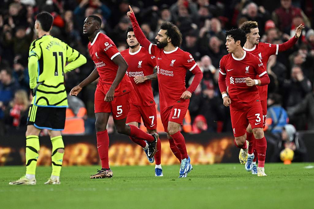 Mohamed Salah (#11) of Liverpool celebrates after scoring his team's first goal against Arsenal during their Premier League match at Anfield in Liverpool, England, December 23, 2023. /CFP
