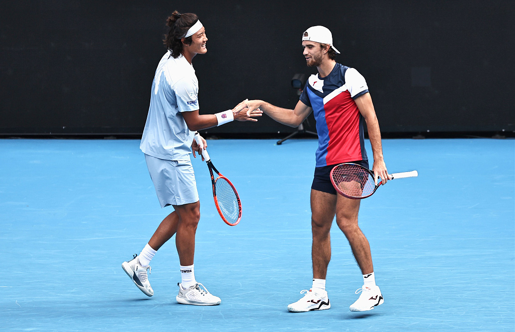 Zhang Zhizhen (L) of China and Tomas Machac of the Czech Republic celebrate their victory over American-British pair Rajeev Ram/Joe Salisbury (not pictured) at Australian Open in Melbourne, Australia, January 21, 2024. /CFP