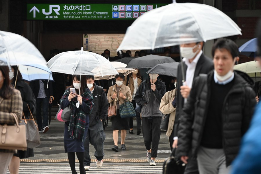 Pedestrians walk on the street in Tokyo, Japan, November 15, 2022. /Xinhua