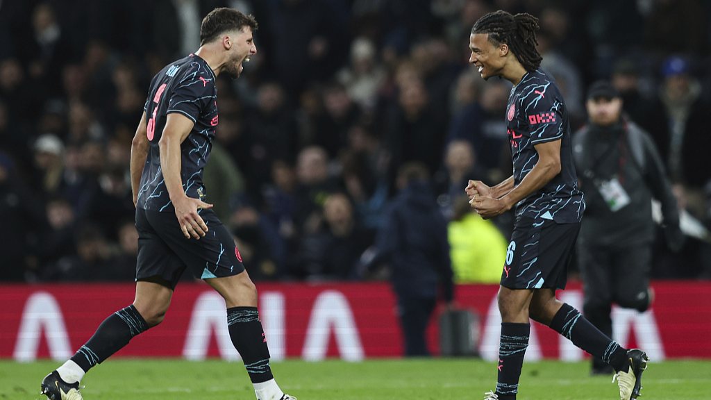 Manchester City's Ruben Dias and Nathan Ake (R) celebrate after their FA Cup clash with Tottenham Hotspur in London, UK, January 26, 2024. /CFP