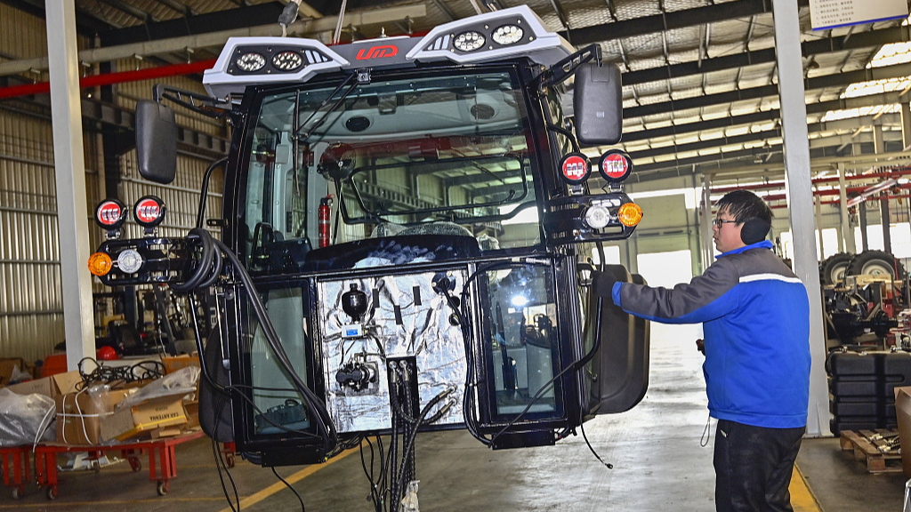 A worker operates on a tractor assembly line in east China’s Shandong Province, January 27, 2024. /CFP