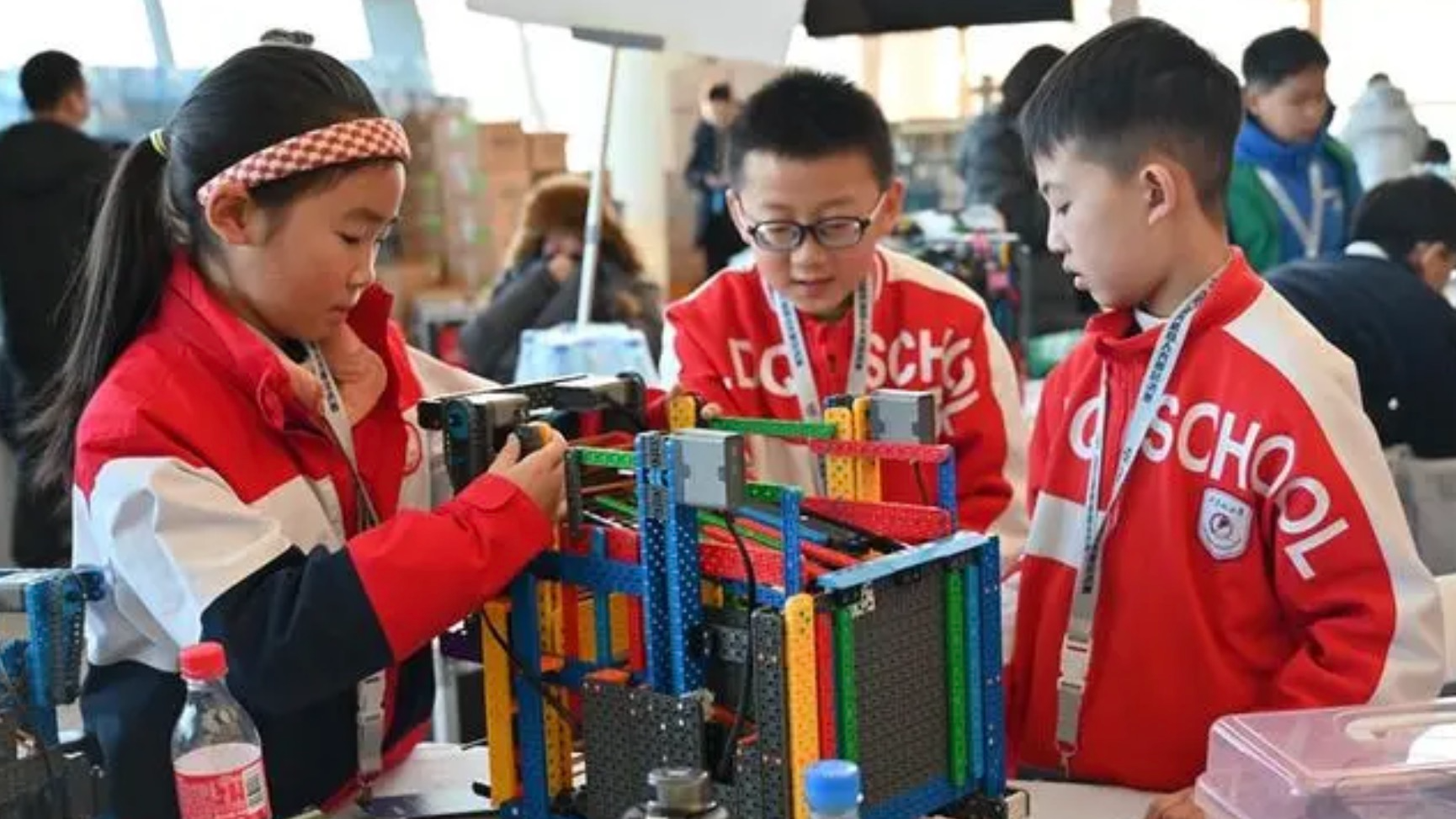 Contestants debug a robot in the youth robot design contest at the World Robot Contest Finals (WRCF) 2023 in Baishan City, northeast China's Jilin Province, January 26, 2024. /Xinhua