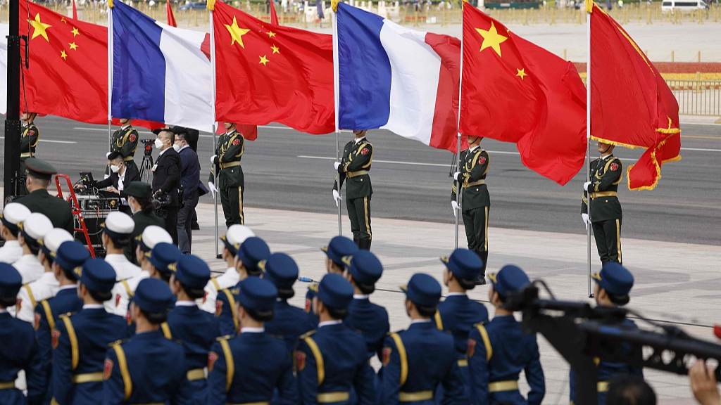 Chinese and French flags fly in front of the Great Hall of the People in Beijing, capital of China, April 6, 2023. /CFP