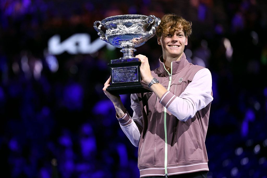 Jannik Sinner of Italy celebrates with the Australian Open men's singles championship trophy after beating Daniil Medvedev of Russia 3-2 in the final at Melbourne Park in Melbourne, Australia, January 28, 2024. /CFP