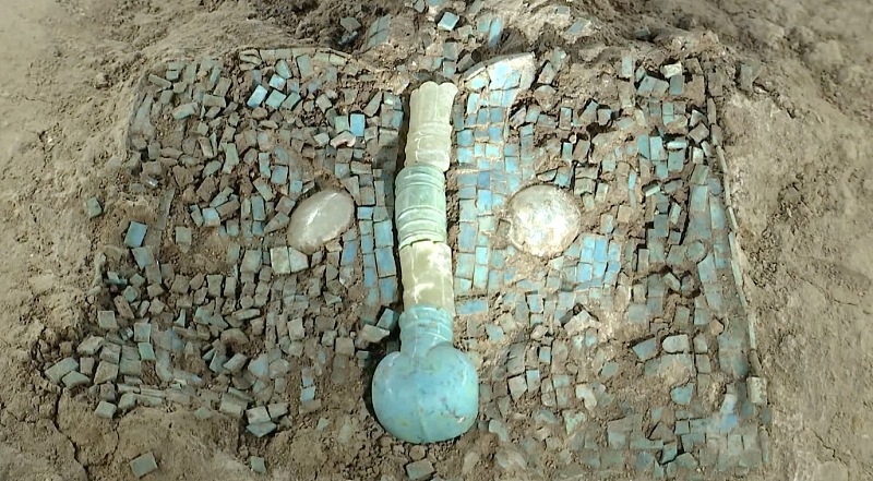 The loong-shaped artifact unearthed from the Erlitou archaeological site is seen on display at the Chinese Archaeological Museum in Beijing, September 15, 2023. /CFP