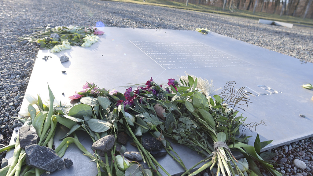 Flowers lie on a memorial plaque on the site of the former Buchenwald concentration camp in Thuringia, Weimar, Germany, January 27, 2024. /CFP