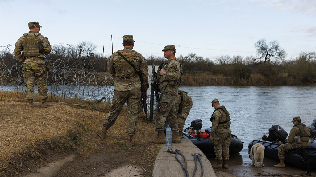 Texas National Guard soldiers wait near the boat ramp where law enforcement enters the Rio Grande at Shelby Park in Eagle Pass, Texas, January 26, 2024. /CFP