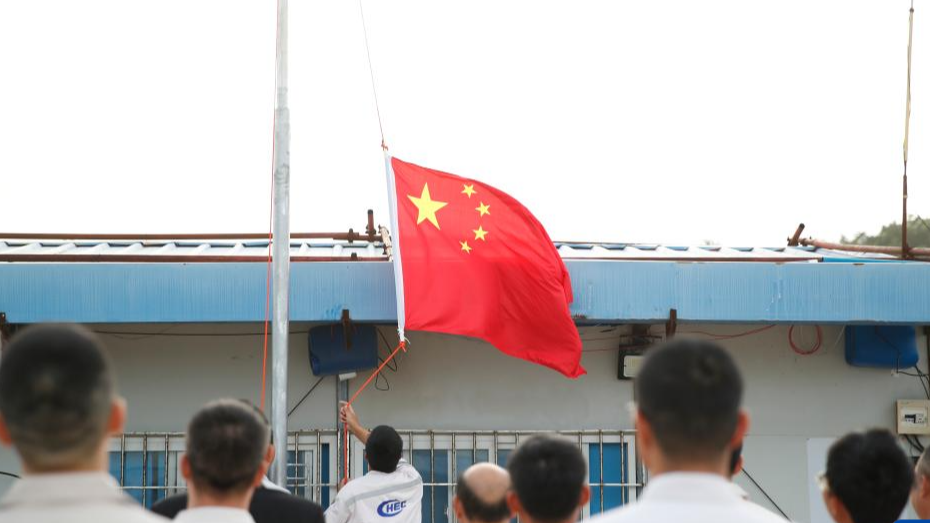 A Chinese diplomatic team responsible for reestablishing the Chinese embassy in Nauru holds a Chinese national flag-raising ceremony in the Republic of Nauru, January 29, 2024. /Xinhua