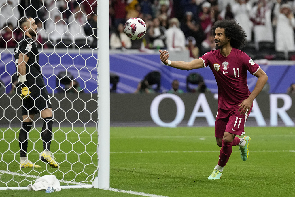 Qatar's Akram Afif celebrates after scoring his team's second goal during  their Asian Cup clash with Palestine at Al-Bayt Stadium in Al Khor, Qatar, January 29, 2024. /CFP