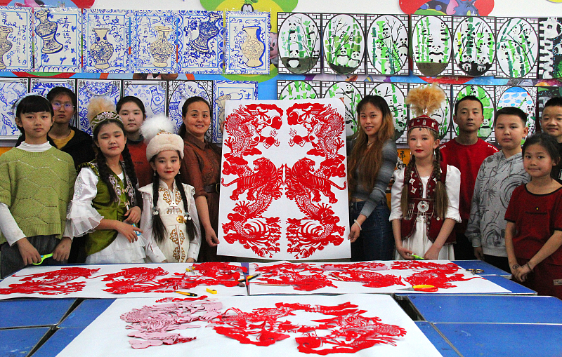 Students showcase their paper-cutting artworks ahead of the Chinese New Year in Tacheng Prefecture, northwest China's Xinjiang Uygur Autonomous Region, January 29, 2024. /CFP