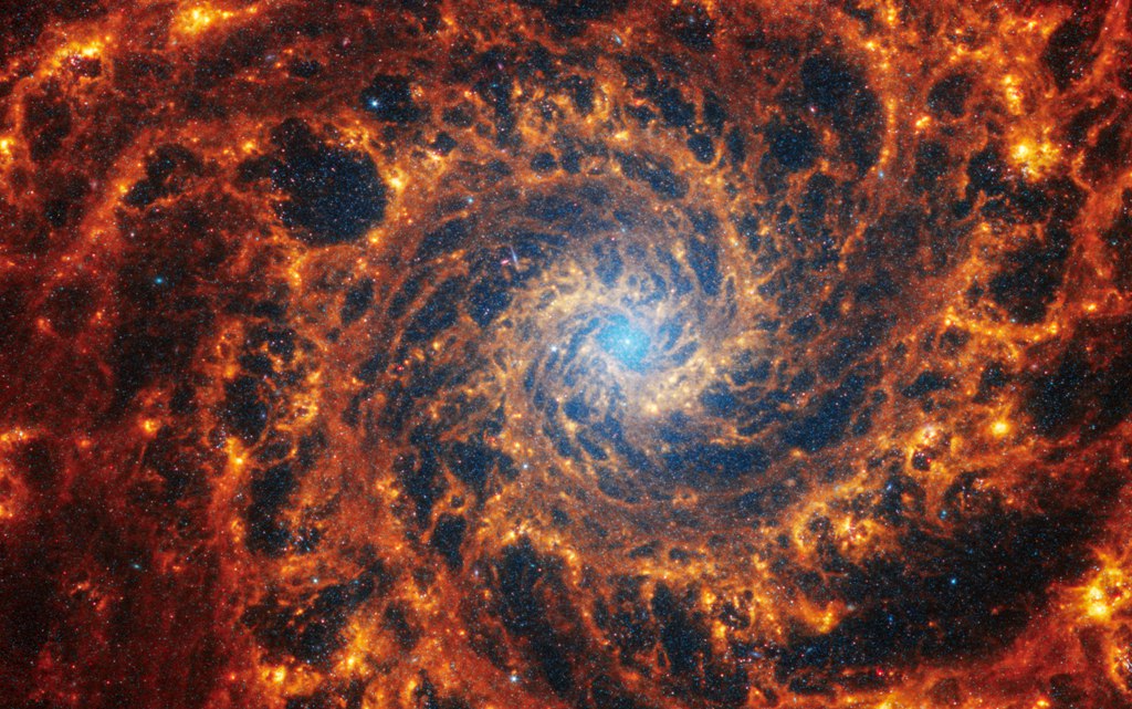 Spiral galaxy NGC 628, 32 million light years away in the constellation Pisces. /NASA