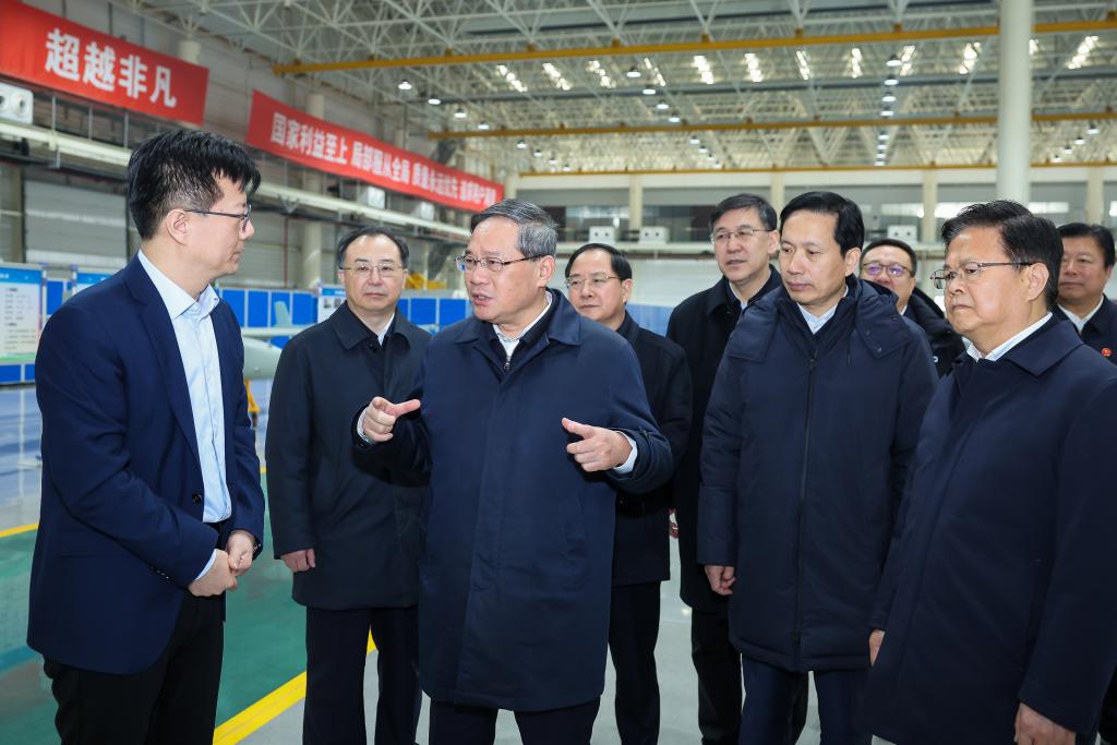 Chinese Premier Li Qiang, also a member of the Standing Committee of the Political Bureau of the Communist Party of China Central Committee, visits a drone production company in Xi'an, northwest China's Shaanxi Province, January 30, 2024. /Xinhua