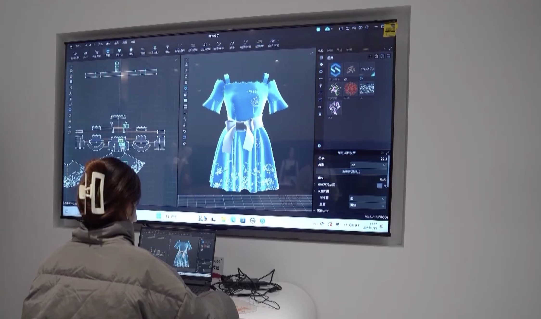 A student majoring in textiles is working on 3D virtual clothing design. /CMG