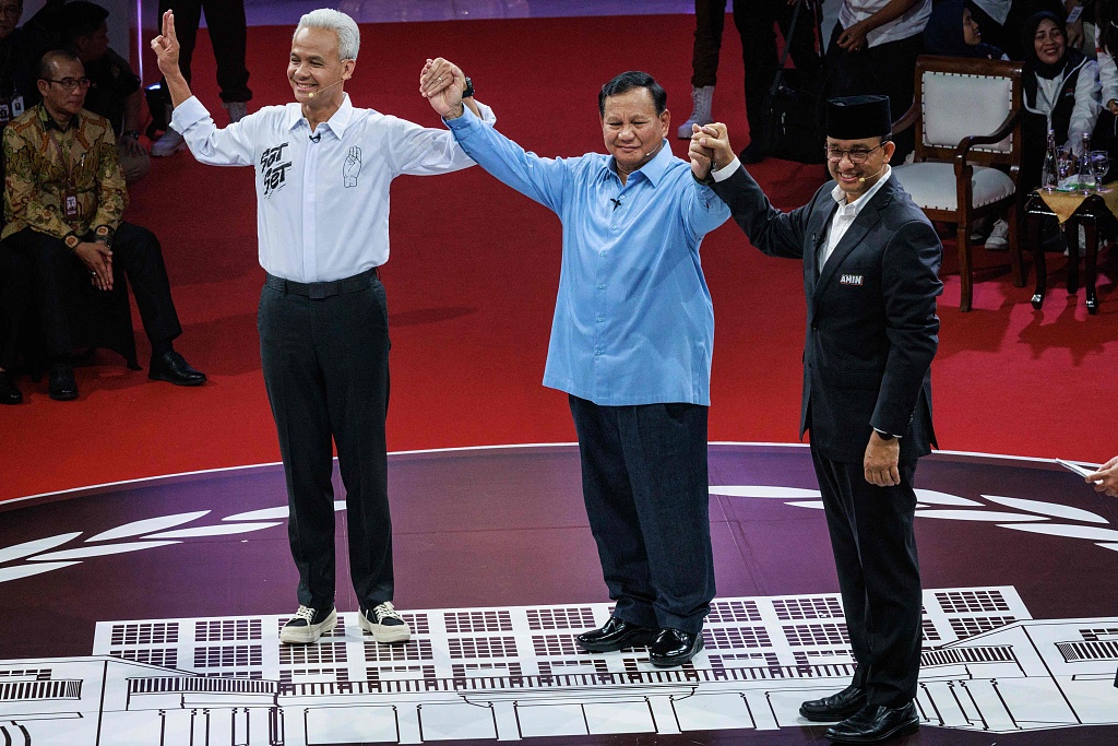 Indonesia's presidential candidates, Anies Baswedan (R), Prabowo Subianto (C) and Ganjar Pranowo (L) pose after the first presidential election debate at the General Elections Commission office in Jakarta, Indonesia, December 12, 2023. /CFP