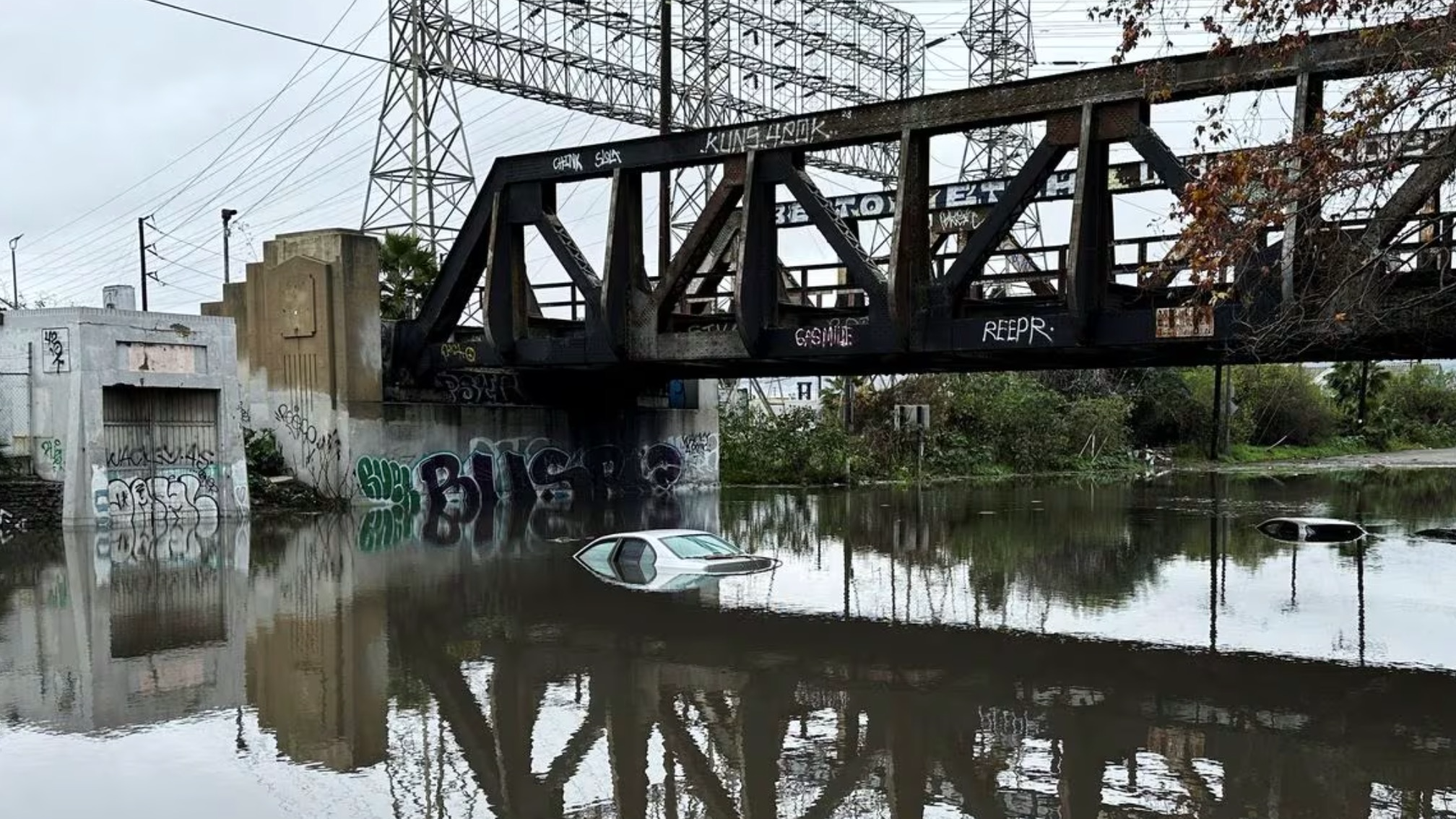 Cars lie partially submerged in water, as the first in a pair of Pacific storms floods parts of Southern California, in Long Beach, California, February 1, 2024. /CFP