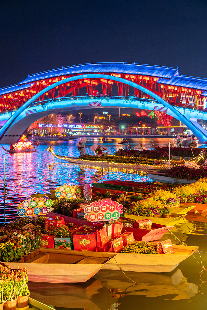 A photo taken on February 5, 2024 shows boats loaded with flowers and other goods at the waterborne flower market in Foshan, Guangdong Province, China. /CFP
