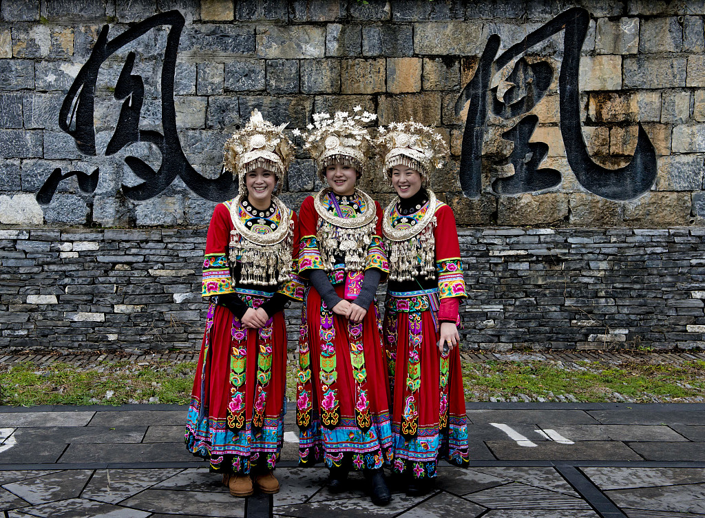 Three women of Miao ethnic group in Fenghuang ancient town. /CFP