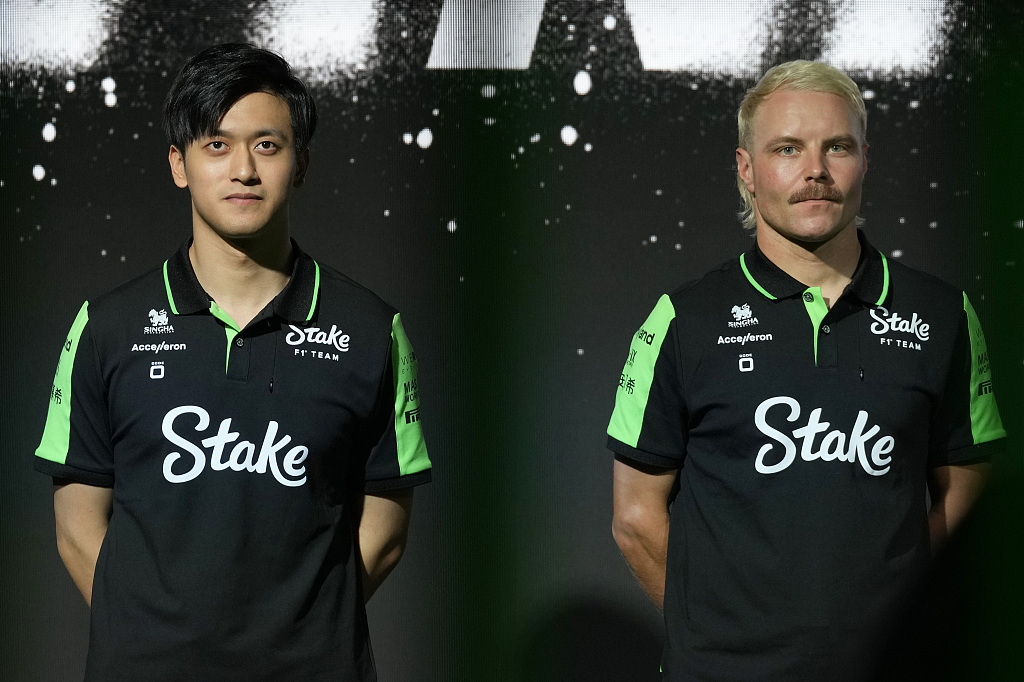 Zhou Guanyu (L) and teammate Valtteri Bottas of Sauber Stake F1 Team at the launch of Stake F1 Team C44 race car in London, England, February 5, 2024. /CFP 