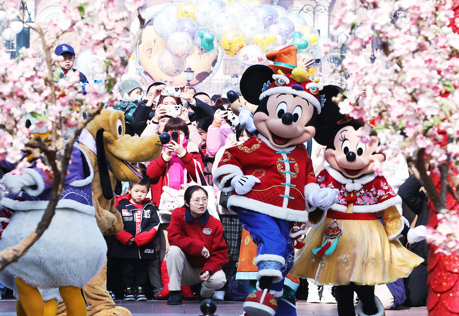 Disney characters celebrate the Spring Festival with visitors at Shanghai Disney Resort on February 10, 2024, Chinese New Year's Day. /IC