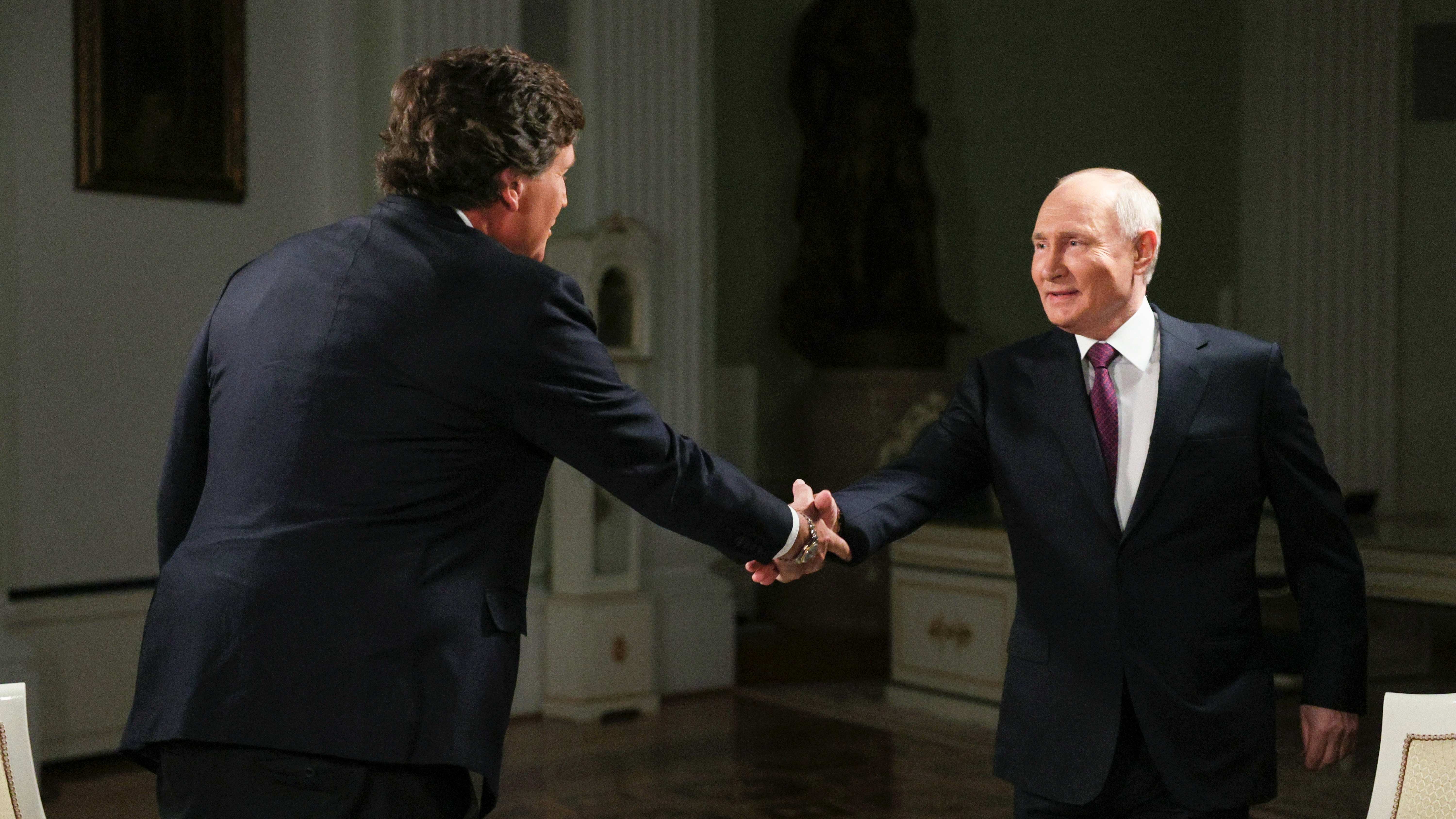 Russian President Vladimir Putin (R) shakes hands with former Fox News host Tucker Carlson at the Kremlin in Moscow, Russia, February 6, 2024. /AP