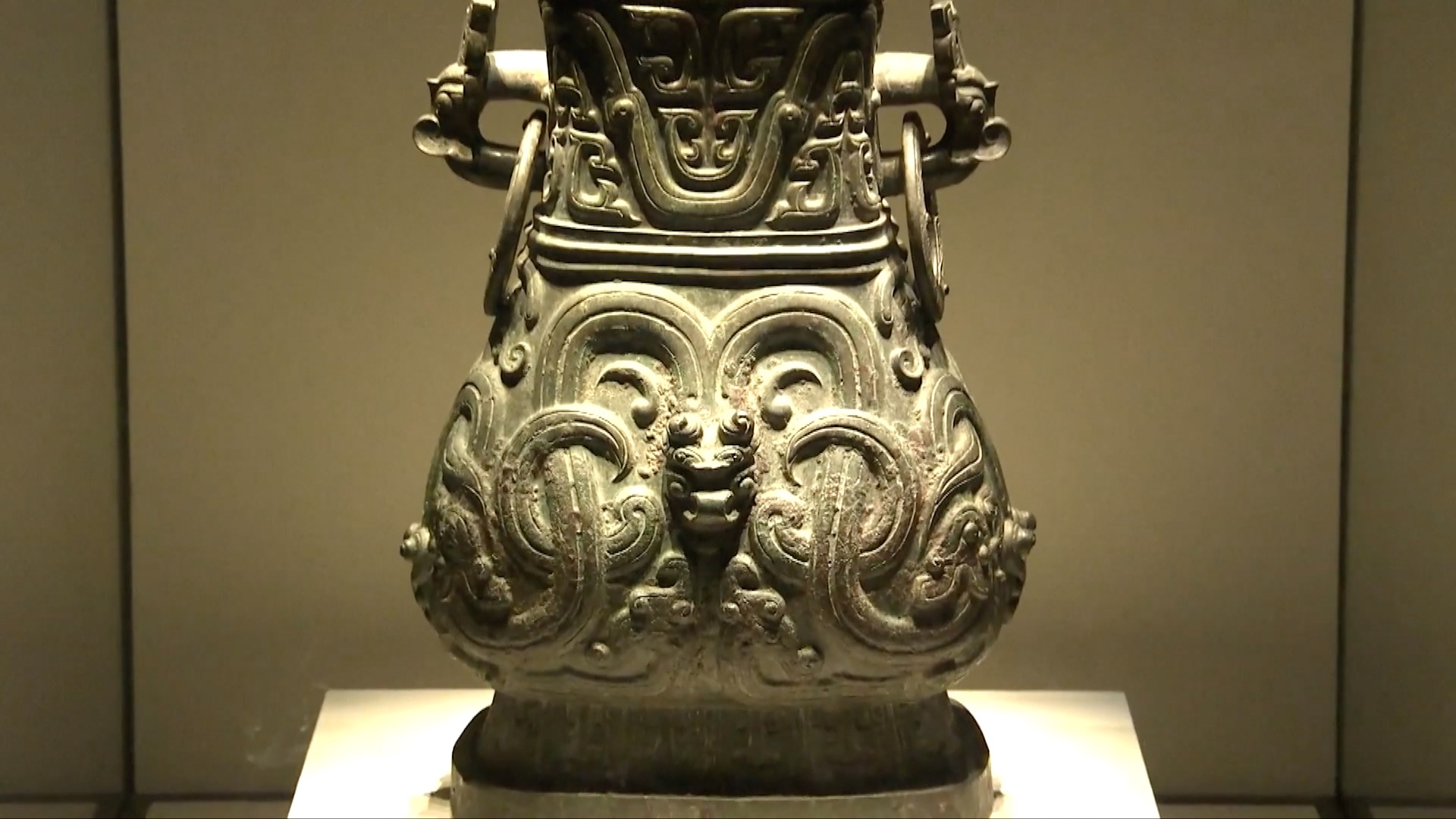 Dragon patterns on bronzeware on display at the National Museum of China. / CGTN