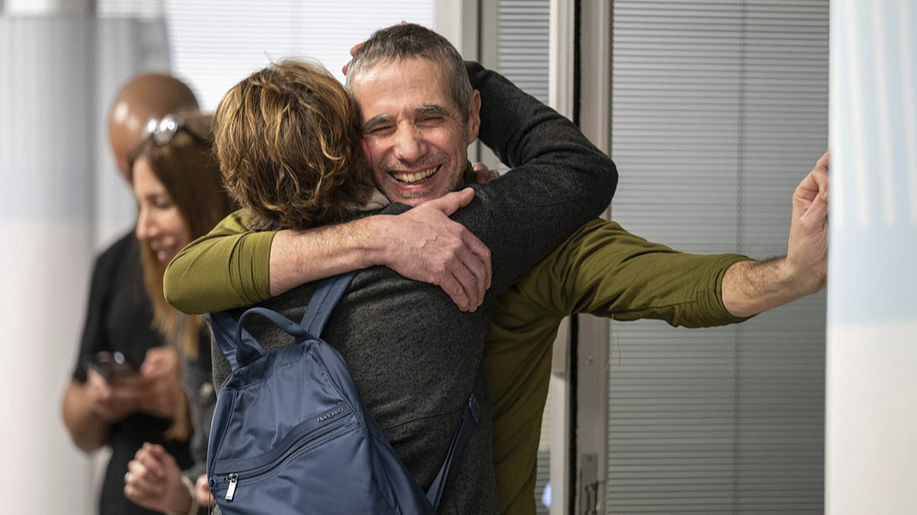Hostage Fernando Simon Marman, right, hugs a relative after being rescued from captivity in the Gaza Strip, at the Sheba Medical Center in Ramat Gan, Israel, February 12, 2024. /CFP
