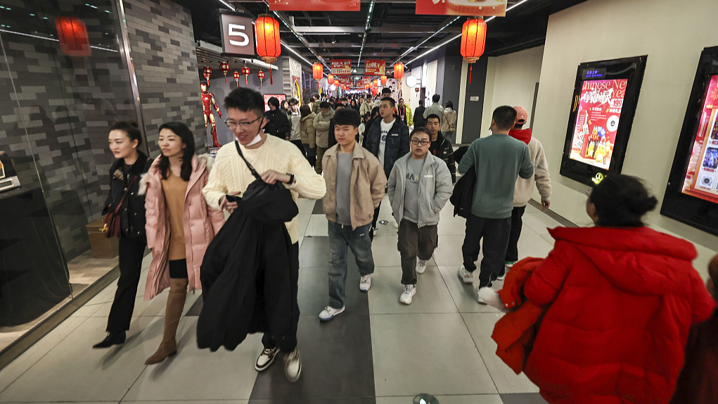 People go to cinemas in Taiyuan City, north China's Shanxi Province, February 12, 2024. /CFP