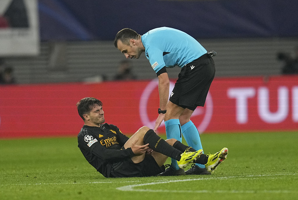Brahim Diaz (L) of Real Madrid lies on the ground injured in the first-leg of the UEFA Champions League Round of 16 against RB Leipzig at Red Bull Arena in Leipzig, Germany, February 13, 2024. /CFP