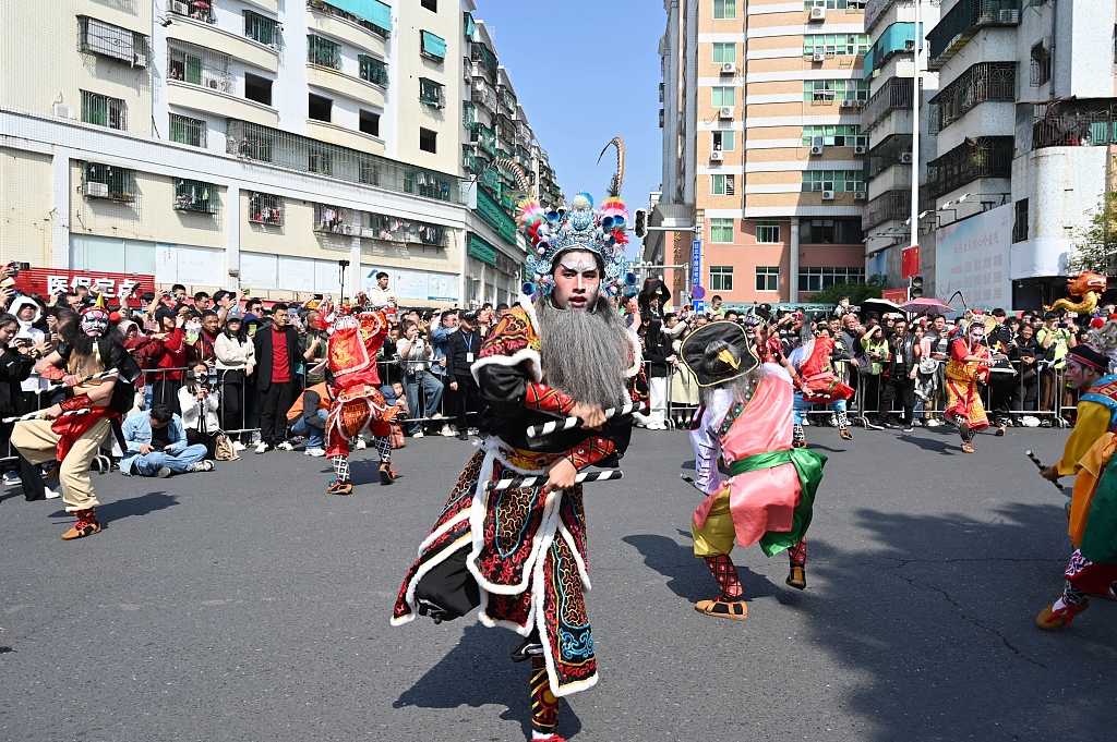 A Yingge dance performance is seen on the streets of Shantou in south China’s Guangdong Province on February 14, 2024. /CFP