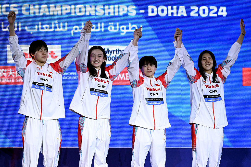 L-R: Yang Peiqi, Li Bingjie, Gong Zhenqi and Ai Yanhan of China celebrate after winning the women's 4x200-meter freestyle relay gold medal at the World Aquatics Championships in Doha, Qatar, February 15, 2024. /CFP