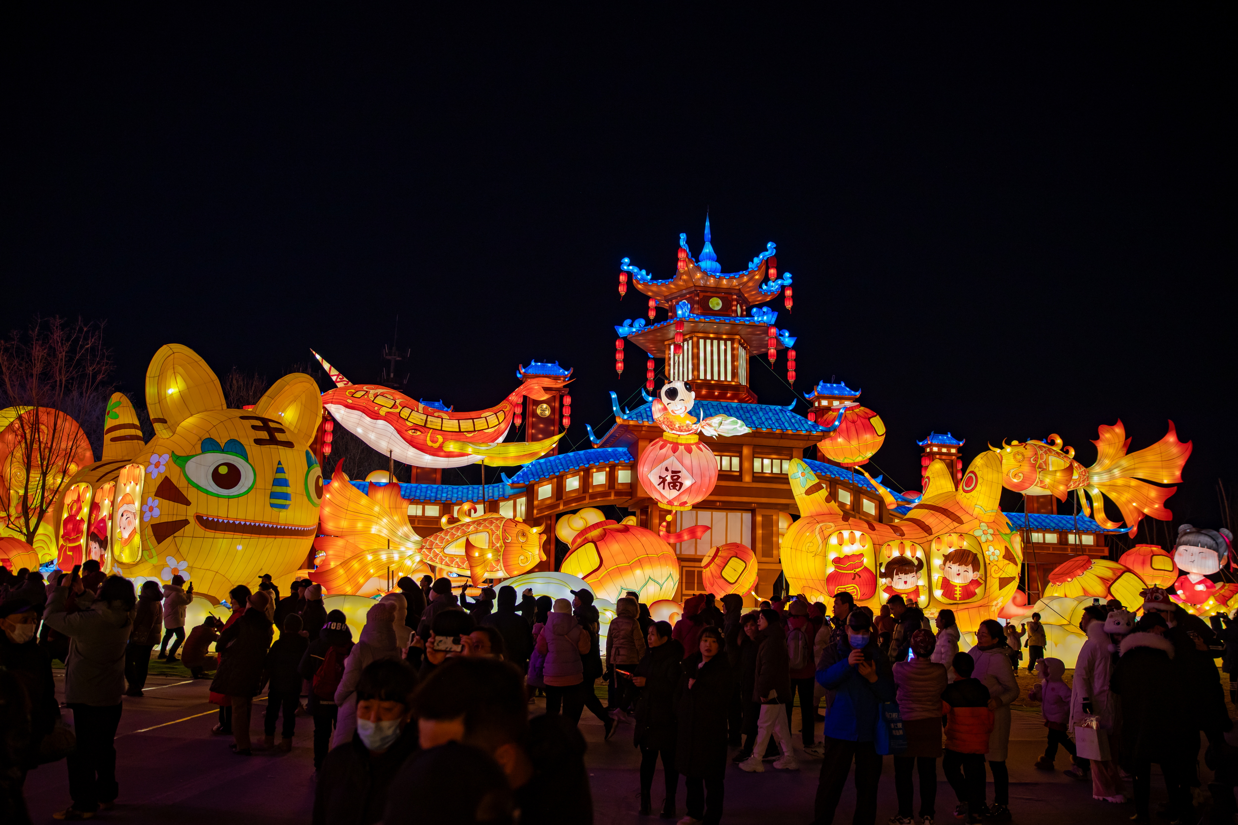 Visitors enjoy festive lanterns at Beijing Wenyuhe Park on February 15, 2024, where the city's biggest lantern show is ongoing. /CFP