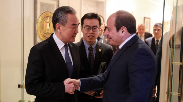 Chinese Foreign Minister Wang Yi (L), also a member of the Political Bureau of the CPC Central Committee, meets with Egyptian President Abdel-Fattah al-Sisi (R) in Cairo, Egypt, January 14, 2024. /Chinese Foreign Ministry 