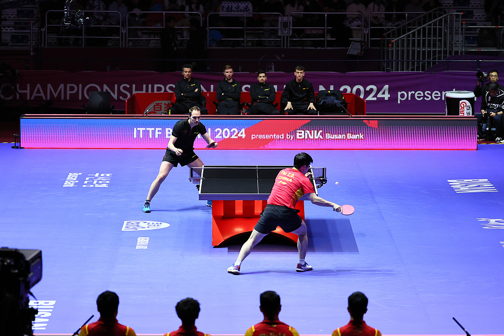 Fan Zhendong (R) and Cedric Nuytinck in action during the ITTF World Team Table Tennis Championships Finals men's event in Busan, South Korea, February 16, 2024. /CFP