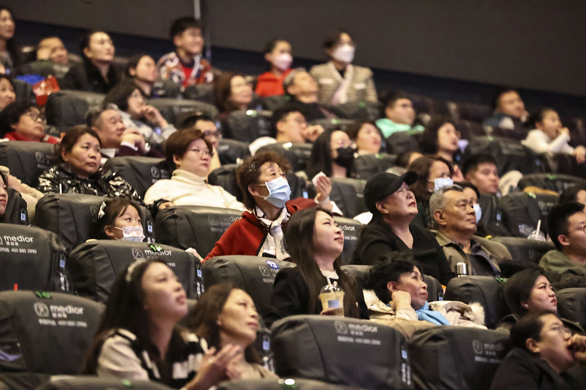 People watch a film during the Spring Festival holiday season, Taiyuan, capital of north China's Shanxi Province, February 12, 2024. /CFP