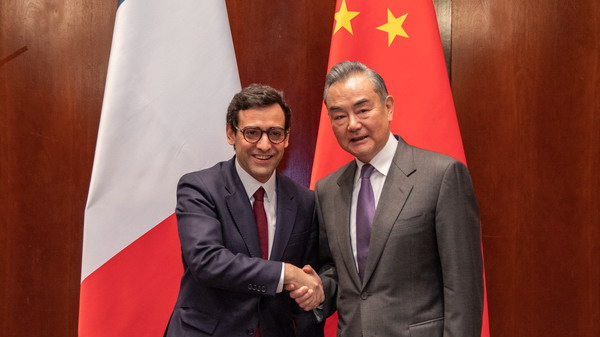 Chinese Foreign Minister Wang Yi (R), also also a member of the Political Bureau of the Communist Party of China Central Committee, shakes hands with French Foreign Minister Stephane Sejourne on the sidelines of the ongoing Munich Security Conference in Germany, February 17, 2024. /Chinese Foreign Ministry