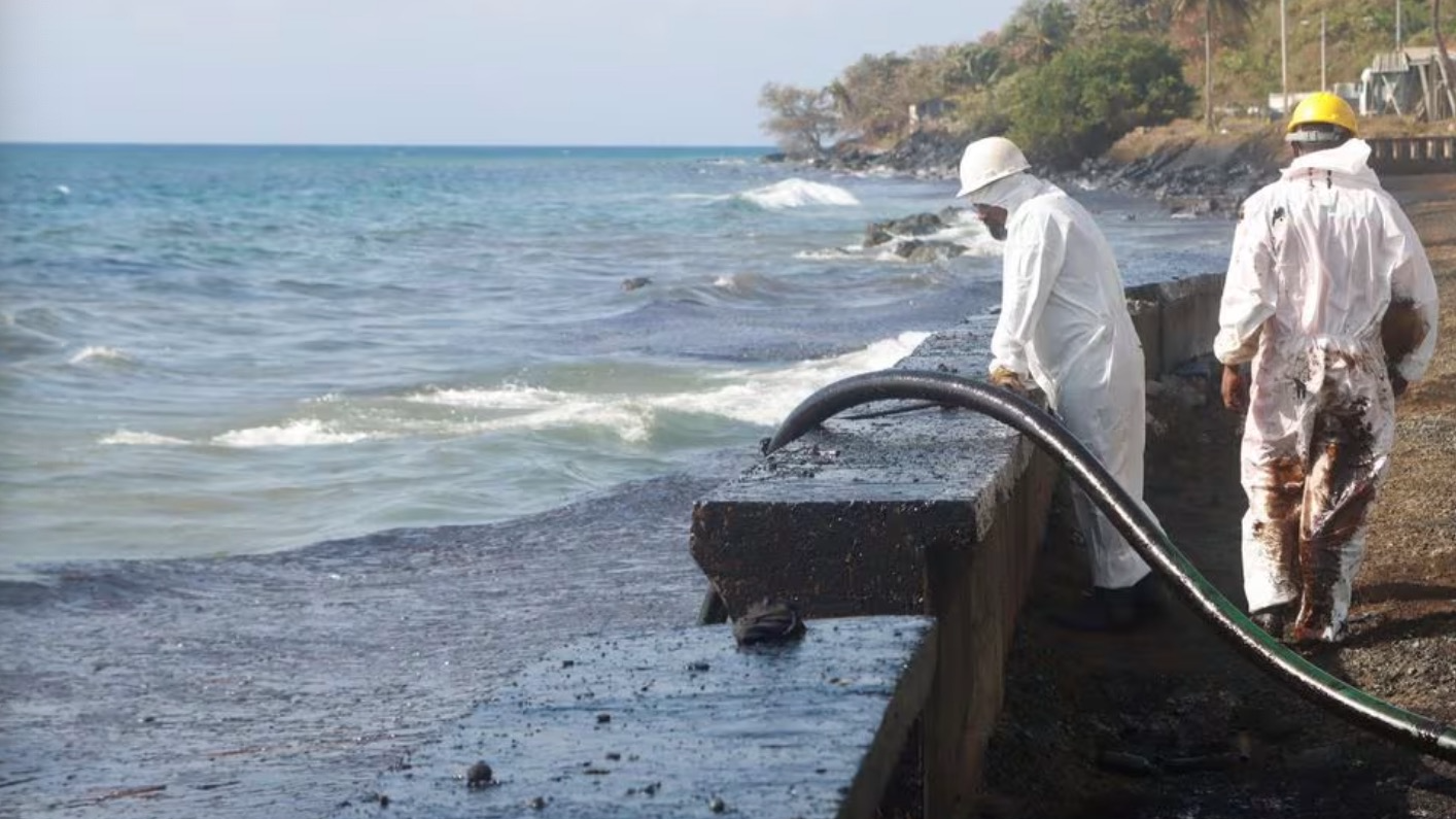 Oil Mop Environmental Services (OMES) workers suction oil from a spill at Magdalena Grand Resort, in Tobago Island, Trinidad and Tobago, February 16, 2024. /CFP