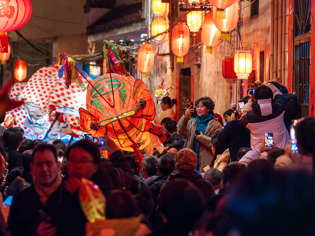 People attend a parade with fish-shaped lanterns in Zhanqi Village of Shexian County, Anhui Province on February 16, 2024, the 7th day of the Chinese New Year. /CFP
